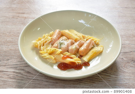 bake fusilli and penne with pork sausage chees dressing seaweed on plate bake fusilli and penne with pork sausage chees dressing seaweed on plate 89901408