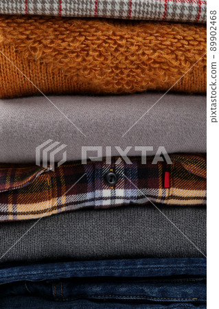 Stack of winter clothes all over background Stack of winter clothes all over background 89902468