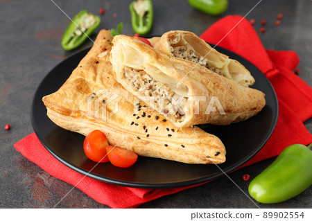 Concept of tasty food with samsa on dark textured background Concept of tasty food with samsa on dark textured background 89902554