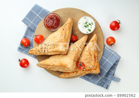 Concept of tasty food with samsa on white background Concept of tasty food with samsa on white background 89902562