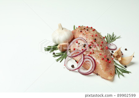 Raw chicken fillet with ingredients on white background 89902599