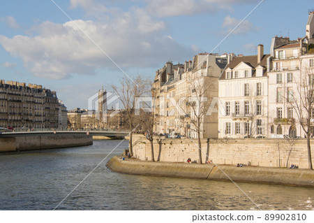 View of Ile Saint-Louis and Pont Saint-Louis across the Seine in Paris View of Ile Saint-Louis and Pont Saint-Louis across the Seine in Paris 89902810