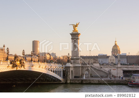 Pont Alexandre III in Paris at sunset and Invalides over there Pont Alexandre III in Paris at sunset and Invalides over there 89902812