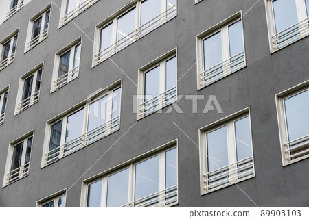 Brussels Industrial zone, Brussels Capital Region, Belgium, Abstract view over the grey rectangular windows of a contemporary building 89903103