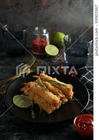 Concept of tasty food with deep-fried shrimp on dark table 89903987