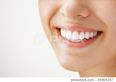 Beautiful female smile after teeth whitening procedure. Dental care. Dentistry concept. Beautiful female smile after teeth whitening procedure. Dental care. Dentistry concept. 89904207