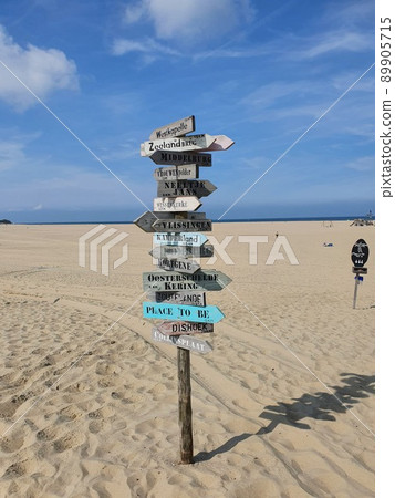 Big colorful Signpost at a beach Big colorful Signpost at a beach 89905715