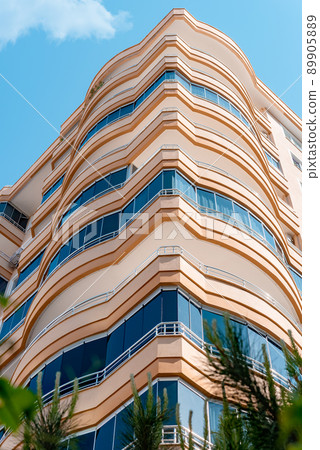 Fragment of a modern residential exterior of an apartment building. Fragment of a modern residential exterior of an apartment building. 89905889