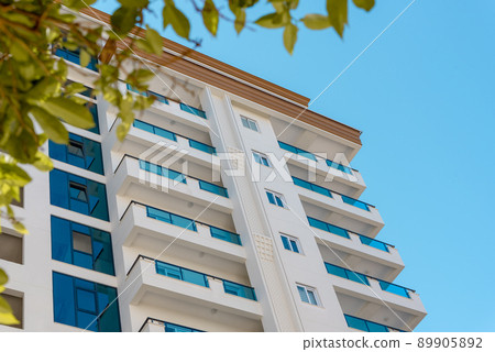 Modern facade of a residential apartment building. Modern facade of a residential apartment building. 89905892