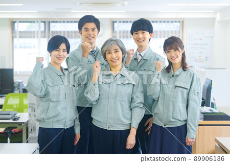 Business team of workers gathered in the office 89906186