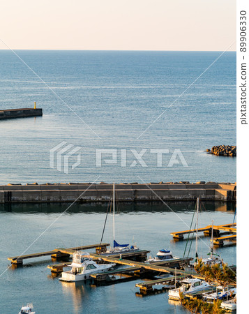 Beautiful early summer evening view of the Sea of Japan Calm sea and marina Beautiful early summer evening view of the Sea of Japan Calm sea and marina 89906330