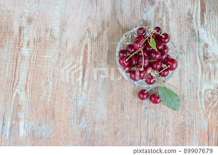 Ripe cherries, cherries in a plate on a wooden background with copy space. Cherry berry. Ripe cherries, cherries in a plate on a wooden background with copy space. Cherry berry. 89907679