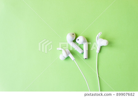 White headphones for talking and listening to music. Gadget and technology concept with copy space. 89907682