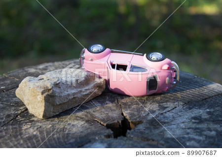 Toy car pink. Accident, insured event. Car insurance company. Toy car pink. Accident, insured event. Car insurance company. 89907687