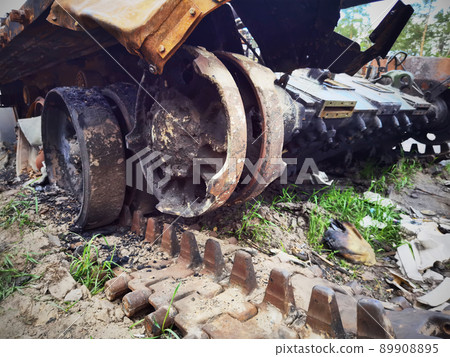 Kyiv region, Ukraine - May 15, 2022: War in Ukraine. Highway Kyiv - Zhytomyr. People take selfies against destroyed russian tank after russian atack in Febrary. Kyiv region, Ukraine - May 15, 2022: War in Ukraine. Highway Kyiv - Zhytomyr. People take selfies against destroyed russian tank after russian atack in Febrary. 89908895
