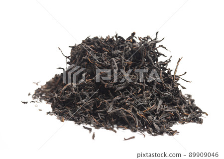 Black tea heap isolated on white background Black tea heap isolated on white background 89909046