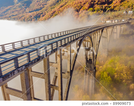 Montenegro. Dzhurdzhevich Bridge Over The River Tara foggy morning 89909073