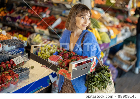 Woman shopping food at market Woman shopping food at market 89909143