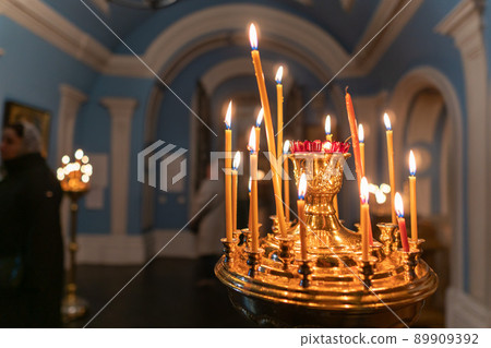 Burning candles in an Orthodox church Burning candles in an Orthodox church 89909392