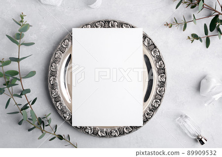 Wedding invitation card mockup 5x7 on silver retro vintage plate on grey background with eucalyptus, Menu card mockup 89909532