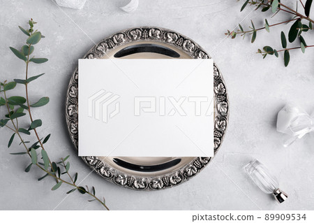 Wedding invitation card mockup 7x5 on silver retro vintage plate on grey background with eucalyptus, menu card mockup 89909534