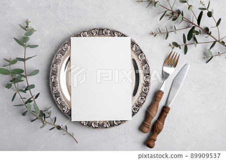Wedding invitation card mockup 5x7 on silver retro vintage plate on grey background with eucalyptus, Menu card mockup Wedding invitation card mockup 5x7 on silver retro vintage plate on grey background with eucalyptus, Menu card mockup 89909537