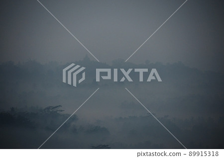 Stupa of Borobudur Temple ruins seen from the hill of Setumbu Stupa of Borobudur Temple ruins seen from the hill of Setumbu 89915318
