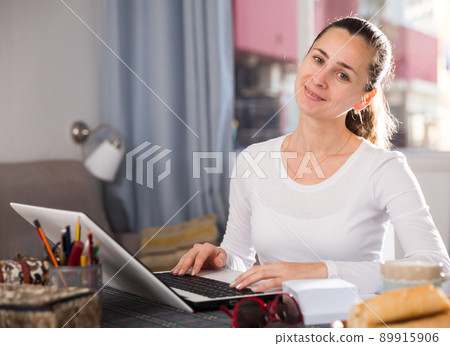 Woman surfing in Internet Woman surfing in Internet 89915906