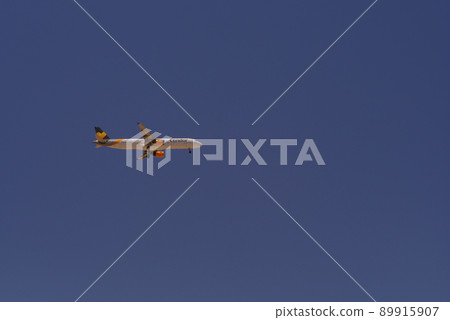 Airbus A321 of Thomas Cook Low-Cost Airline against the blue sky 89915907