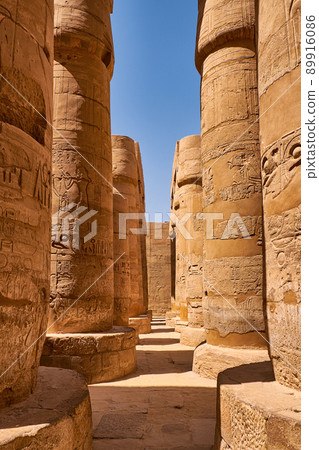 Massive pillars of the Great Hypostyle Hall in the Karnak temple in Luxor, Egypt Massive pillars of the Great Hypostyle Hall in the Karnak temple in Luxor, Egypt 89916086
