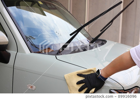 Scenery of car wash while wiping off dirt 89916096