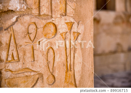 Egyptian hieroglyphs at the Mortuary Temple of Hatshepsut in Luxor, Egypt Egyptian hieroglyphs at the Mortuary Temple of Hatshepsut in Luxor, Egypt 89916715