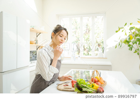 Woman cooking kitchen 89916797