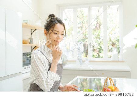 Woman cooking kitchen 89916798