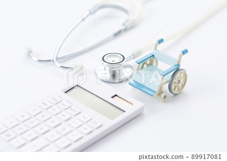 Wheelchair, stethoscope and calculator 89917081