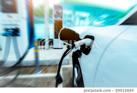 EV car charging at outdoor electric car charging station. EV car charging point. Electric vehicle fast charge concept. DC fast charging station. Quick charge concept. Sustainable power. Green energy. EV car charging at outdoor electric car charging station. EV car charging point. Electric vehicle fast charge concept. DC fast charging station. Quick charge concept. Sustainable power. Green energy. 89918884