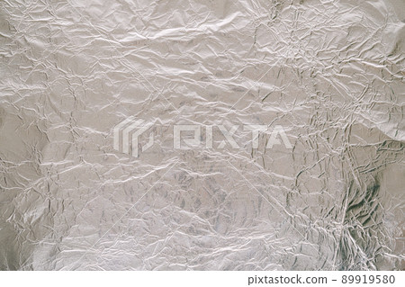 Crumpled tinfoil background texture Crumpled tinfoil background texture 89919580