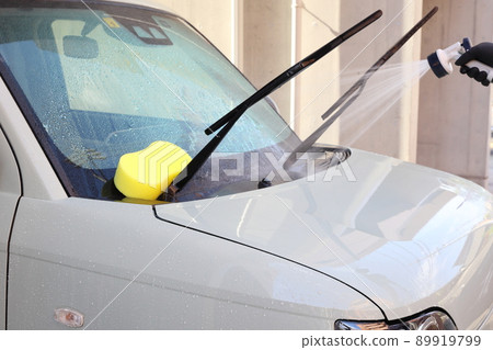 Scenery of car wash while shampooing after flushing small garbage with water Scenery of car wash while shampooing after flushing small garbage with water 89919799