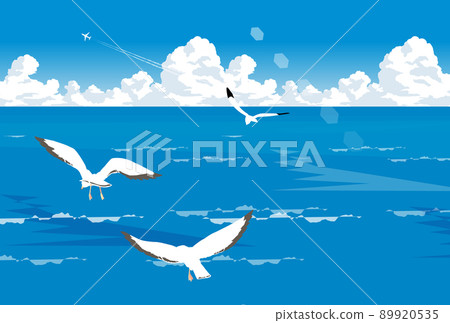 A flock of seabirds flying in the ocean A flock of seabirds flying in the ocean 89920535