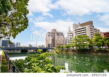 It is a building area along the river on the south side of Hiroshima Station. Business hotels and office buildings are lined up. Please use it as a background for the cityscape. It is a building area along the river on the south side of Hiroshima Station. Business hotels and office buildings are lined up. Please use it as a background for the cityscape. 89921189