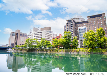 It is a building area along the river on the south side of Hiroshima Station. Business hotels and office buildings are lined up. Please use it as a background for the cityscape. It is a building area along the river on the south side of Hiroshima Station. Business hotels and office buildings are lined up. Please use it as a background for the cityscape. 89921192