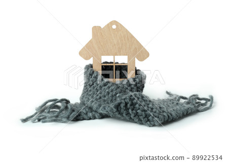 Wooden house with knitted scarf isolated on white background Wooden house with knitted scarf isolated on white background 89922534