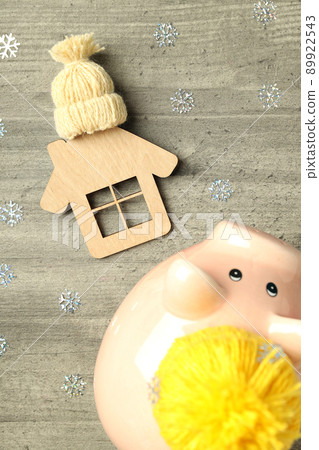 Concept of heating season with piggy bank on gray textured background 89922543