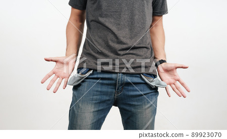 Man turning out the jean pocket to showing empty pocket. bankrupt, bad economy, no money concept. Man turning out the jean pocket to showing empty pocket. bankrupt, bad economy, no money concept. 89923070