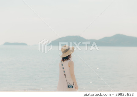 A camera girl in a dress and a beautiful summer sky A camera girl in a dress and a beautiful summer sky 89923658