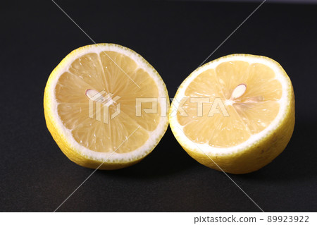 Cross section of lemon on black background Cross section of lemon on black background 89923922