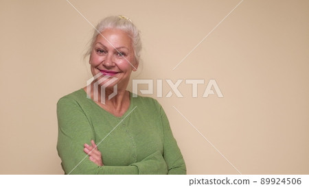 Smiling senior woman looking confident at camera. Smiling senior woman looking confident at camera. 89924506