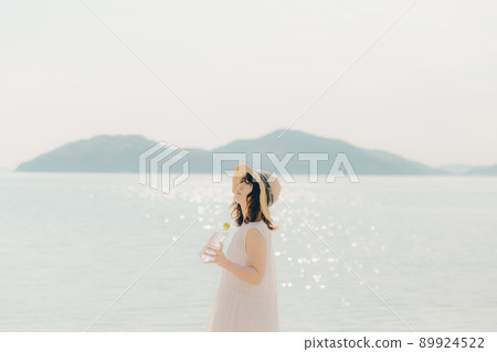 A woman in a dress and a beautiful summer sky 89924522