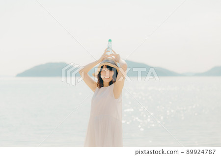 A woman in a dress and a beautiful summer sky A woman in a dress and a beautiful summer sky 89924787