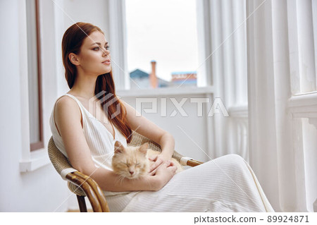 woman together with the cat on the terrace Friendship rest Relaxation concept woman together with the cat on the terrace Friendship rest Relaxation concept 89924871